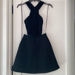 Fun short black dress. Perfect for party, festival.  Halterlike top, open back